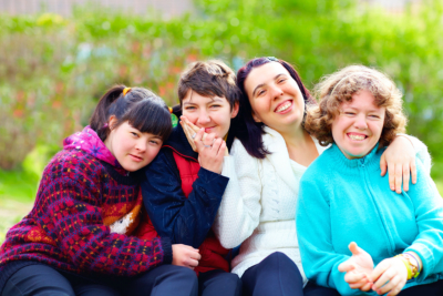 Portrait of happy women with disability having fun in spring park